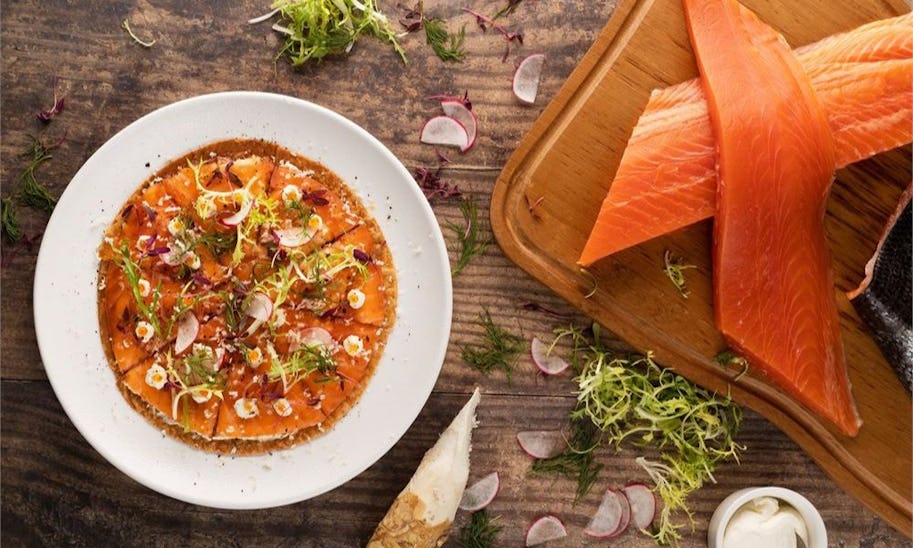 A plate of food being prepared on a counter top