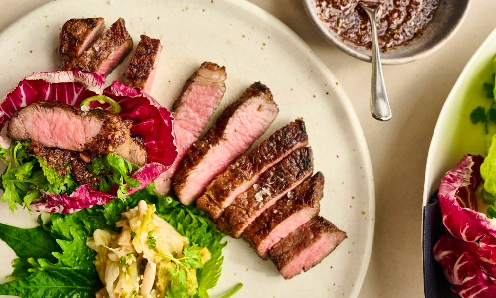 A plate of cut up steak