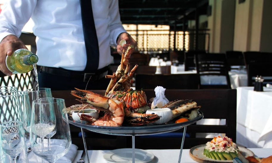 A large seafood platter on a white-cloth covered table