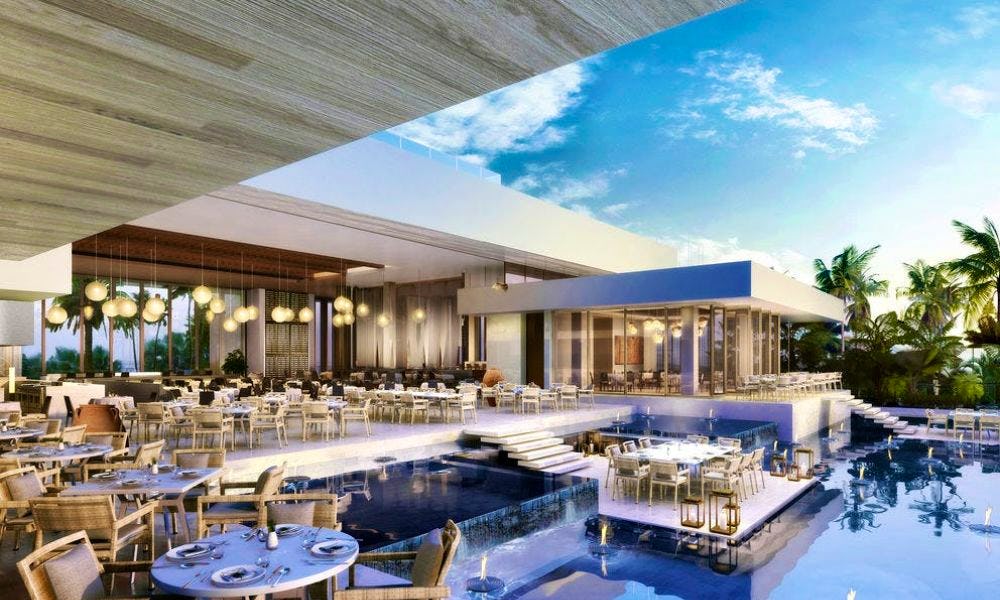 An outdoor restaurant with floating pontoons that have tables on them