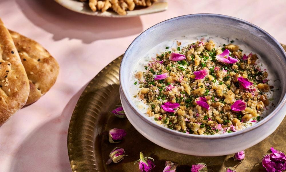 Bowl with pistachios and rose petals