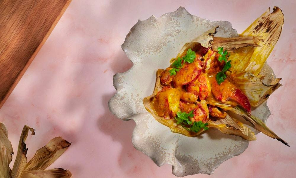 Plate of food on a pink background