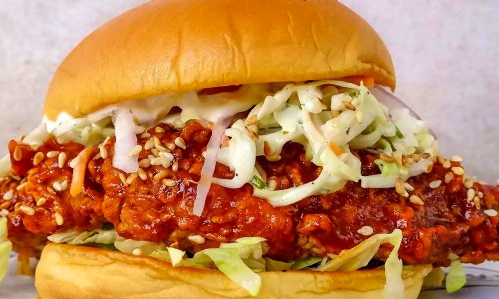 Fried chicken burger with salad in bun