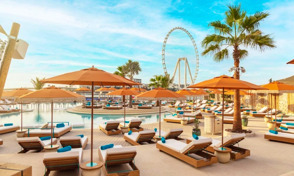 A pool and orange umbrellas