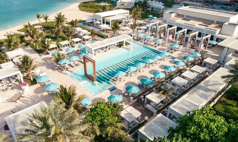 Pool and sun beds and umbrellas