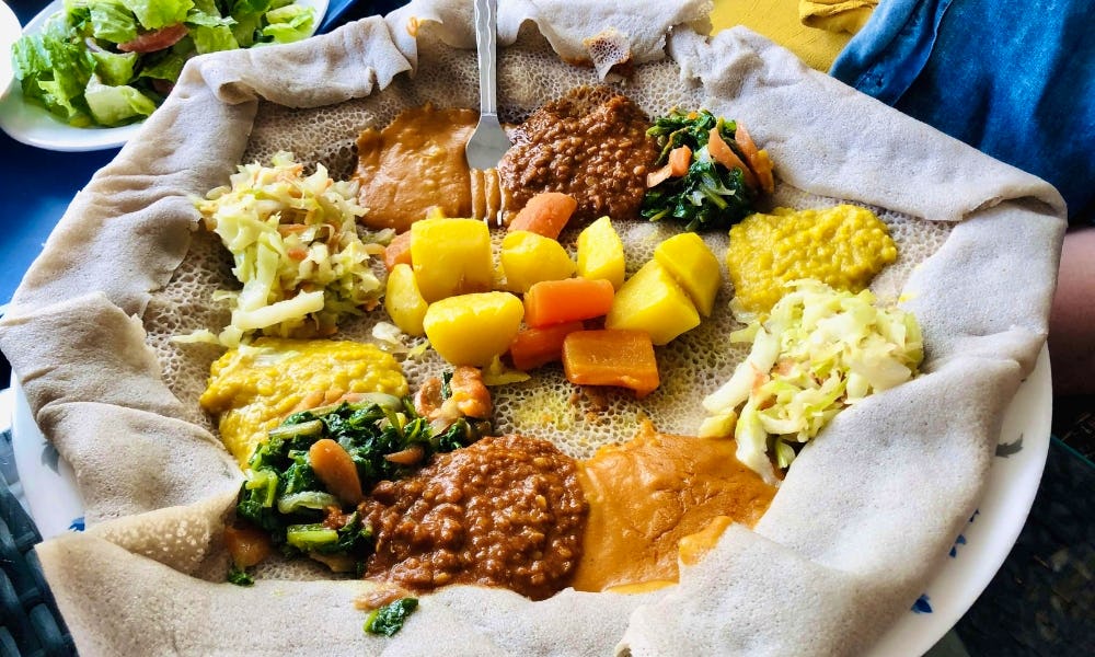 injera with toppings at bonne annee